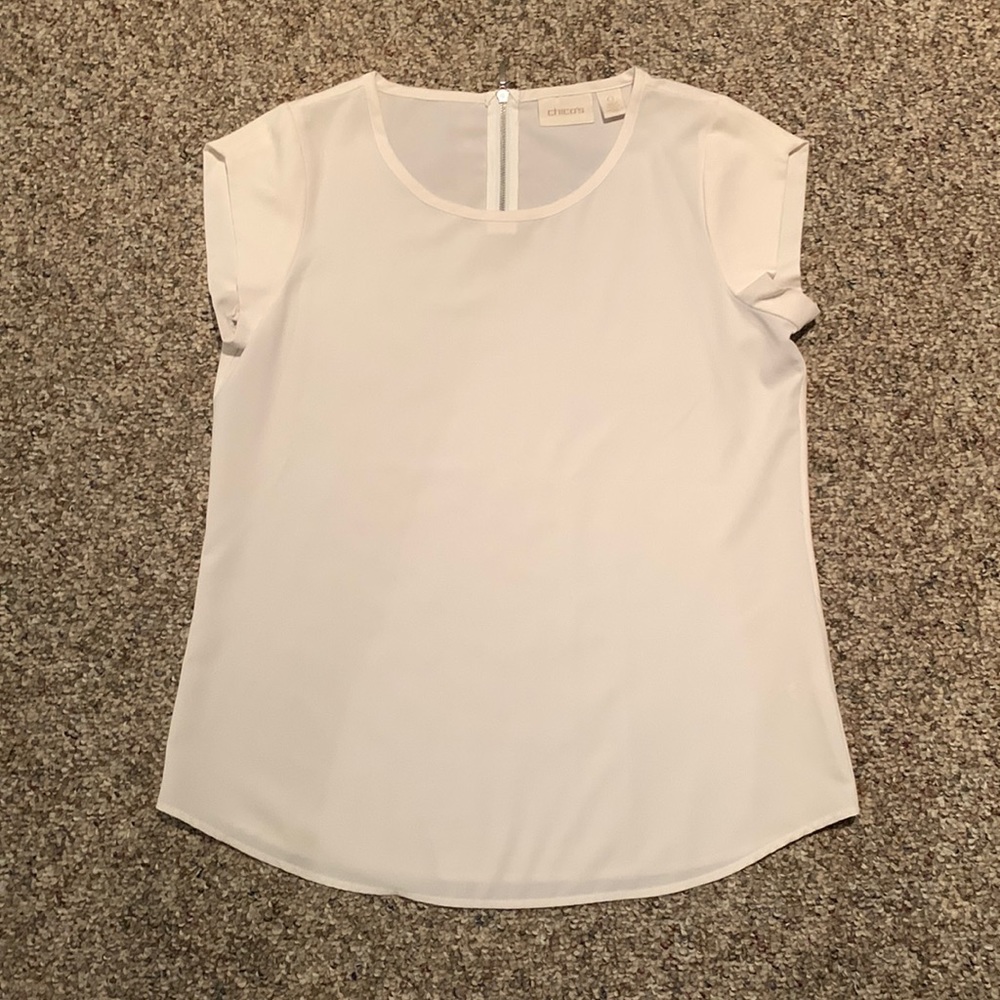 Chico’s white flowy blouse with cap sleeves. Back zipper. Size 0.